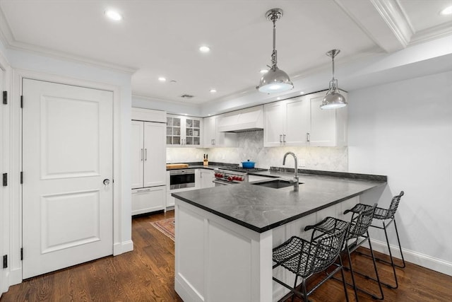 15 Hancock St Unit 1, Boston, MA 02114 - kitchen featuring a sink, custom exhaust hood, a peninsula, dark countertops, and high quality appliances