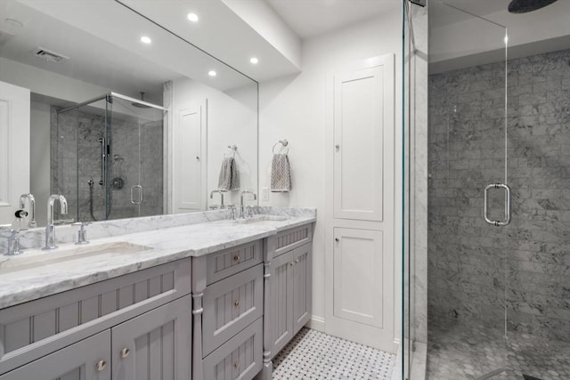 15 Hancock St Unit 1, Boston, MA 02114 - full bathroom featuring double vanity, a stall shower, recessed lighting, and tile patterned floors