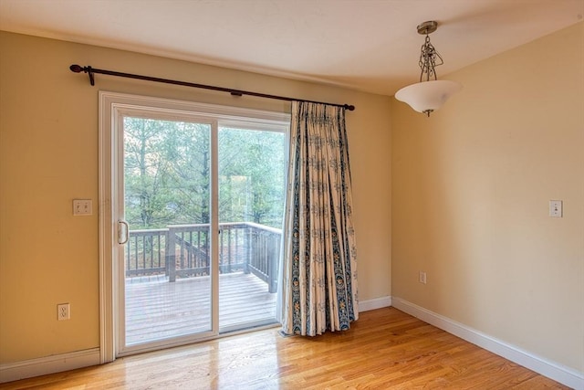 spare room with light hardwood / wood-style flooring