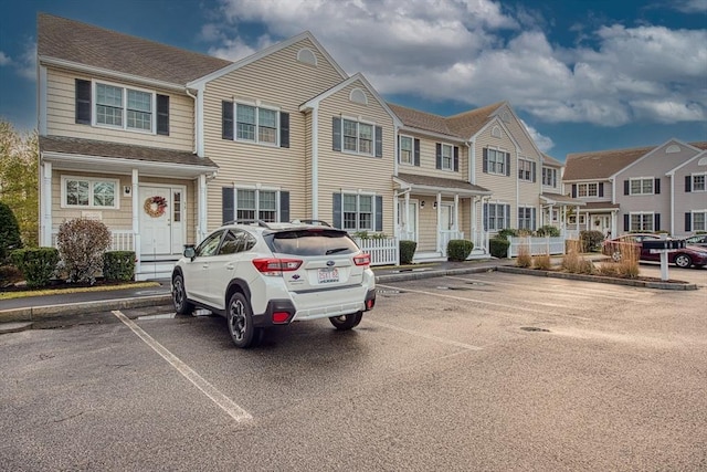 31 Freedom Cir Unit 31, Pembroke, MA 02359 - townhome / multi-family property with uncovered parking, a residential view, and a shingled roof