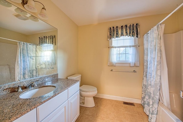 full bathroom featuring tile patterned flooring, shower / bath combo with shower curtain, vanity, and toilet