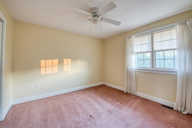 empty room with carpet flooring and ceiling fan