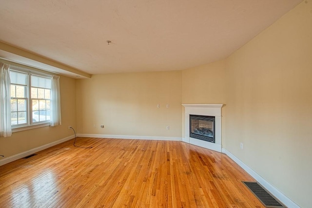 unfurnished living room featuring light hardwood / wood-style flooring