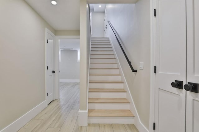 stairway featuring hardwood / wood-style floors