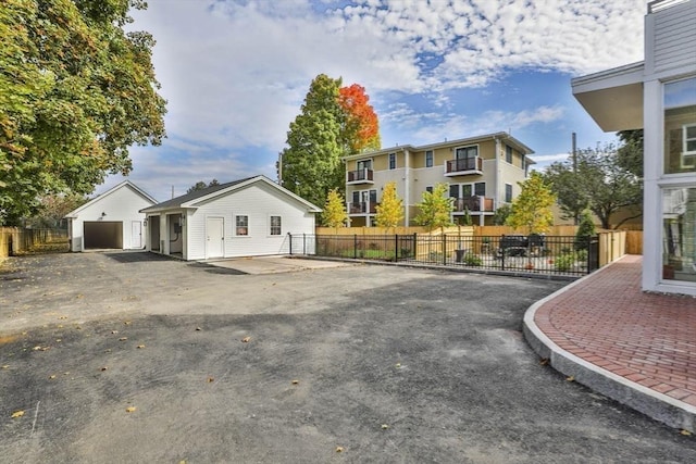 exterior space featuring an outbuilding and a garage