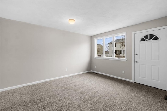 entrance foyer featuring carpet