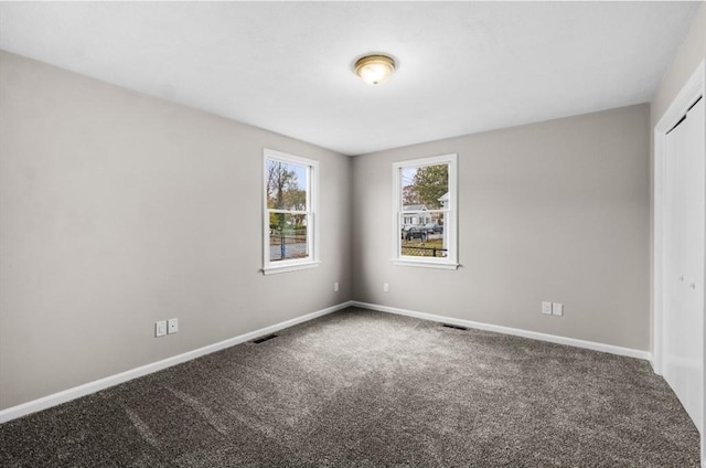 empty room featuring carpet floors