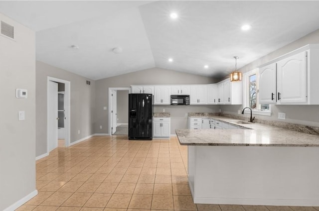 kitchen with pendant lighting, lofted ceiling, black appliances, sink, and white cabinetry