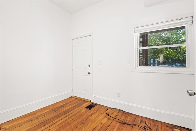 spare room featuring hardwood / wood-style floors