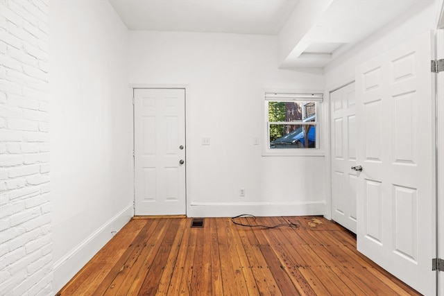 empty room featuring hardwood / wood-style flooring