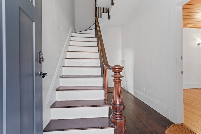 stairway featuring hardwood / wood-style flooring