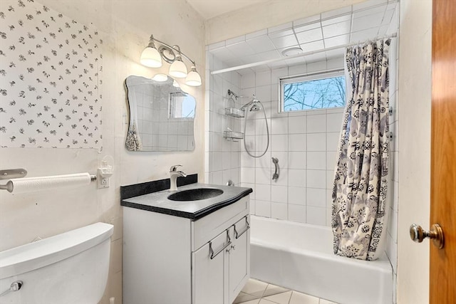 bathroom featuring tile patterned floors, toilet, vanity, and shower / bathtub combination with curtain