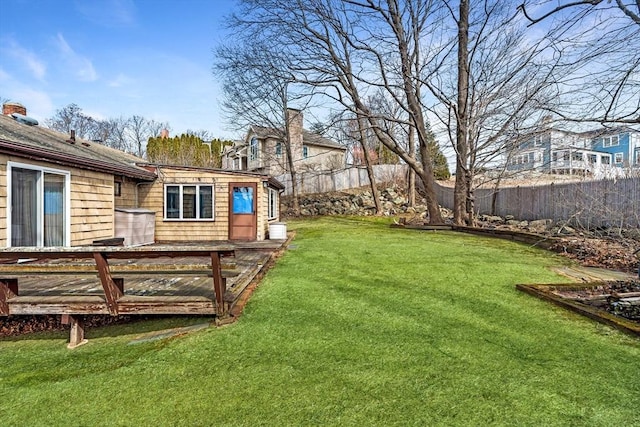 view of yard with a wooden deck and fence