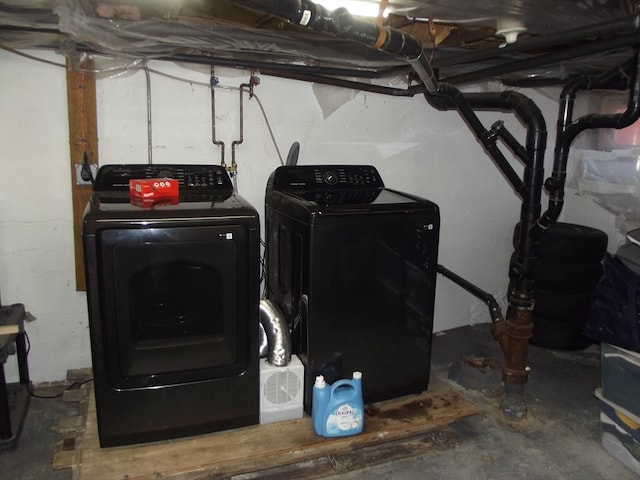 laundry area with washing machine and dryer