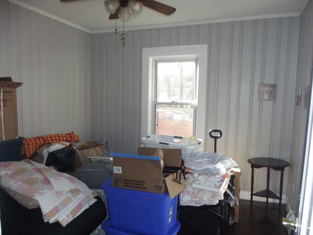 interior space featuring ceiling fan, dark hardwood / wood-style flooring, and ornamental molding