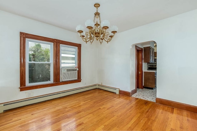 unfurnished room featuring baseboard heating, cooling unit, a chandelier, and light hardwood / wood-style floors