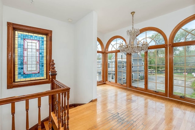 foyer featuring a notable chandelier and light wood-type flooring