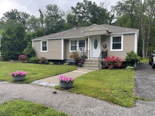41 Knowles Rd, Worcester, MA 01602 - view of front of home with a chimney, a front lawn, and roof with shingles