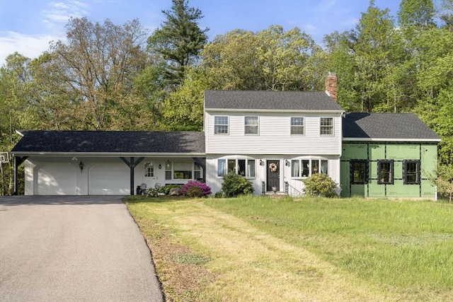230 W St, Paxton, MA 01612 - colonial home with a chimney, a garage, driveway, and a front lawn