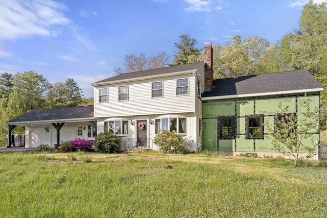 230 W St, Paxton, MA 01612 - colonial inspired home with a chimney, a front lawn, and a carport