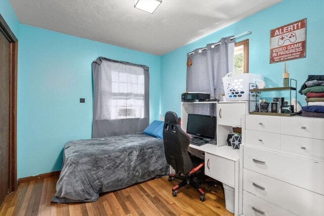 230 W St, Paxton, MA 01612 - bedroom with wood finished floors, baseboards, and a desk