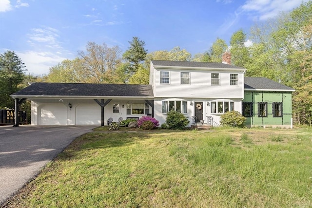 230 W St, Paxton, MA 01612 - colonial house with a chimney, an attached garage, driveway, and a front yard