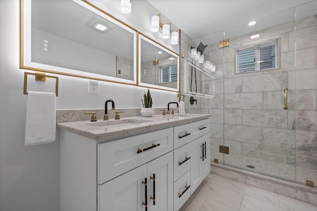 bathroom with vanity and walk in shower