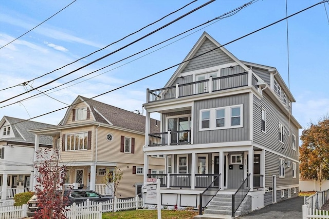 view of front of home with a balcony and a porch