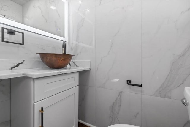 bathroom with vanity and toilet