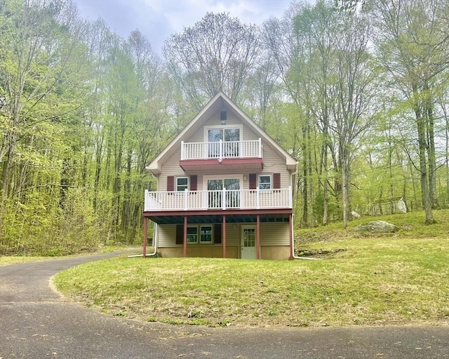 196 Munn Rd, Monson, MA 01057 - chalet / cabin featuring a balcony, a front lawn, a wooden deck, and a forest view