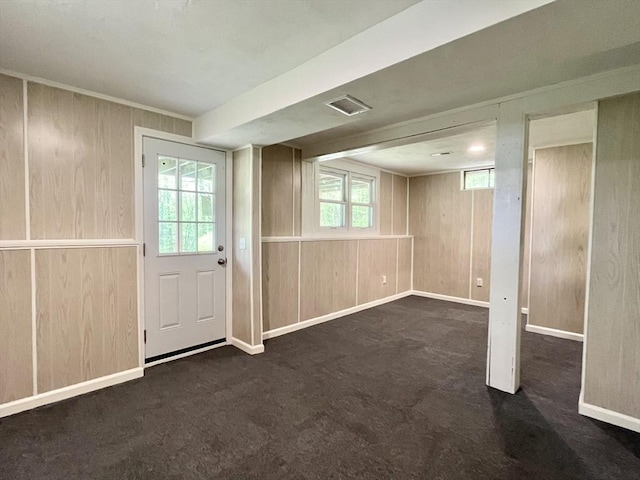 196 Munn Rd, Monson, MA 01057 - basement featuring wooden walls, carpet floors, and baseboards