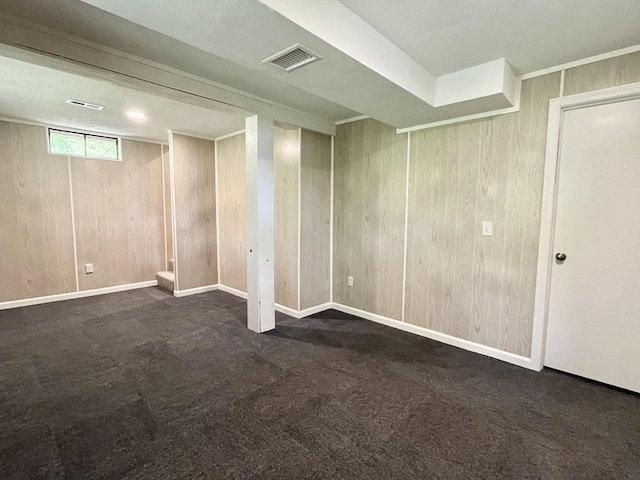 196 Munn Rd, Monson, MA 01057 - below grade area with wood walls, carpet flooring, and baseboards
