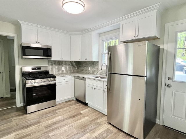 196 Munn Rd, Monson, MA 01057 - kitchen with appliances with stainless steel finishes, a sink, and white cabinetry