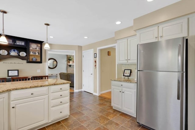 24 Heritage Cir E, Longmeadow, MA 01028 - kitchen featuring freestanding refrigerator, white cabinetry, hanging light fixtures, baseboards, and recessed lighting