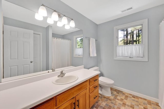 24 Heritage Cir E, Longmeadow, MA 01028 - bathroom featuring baseboards, vanity, and toilet