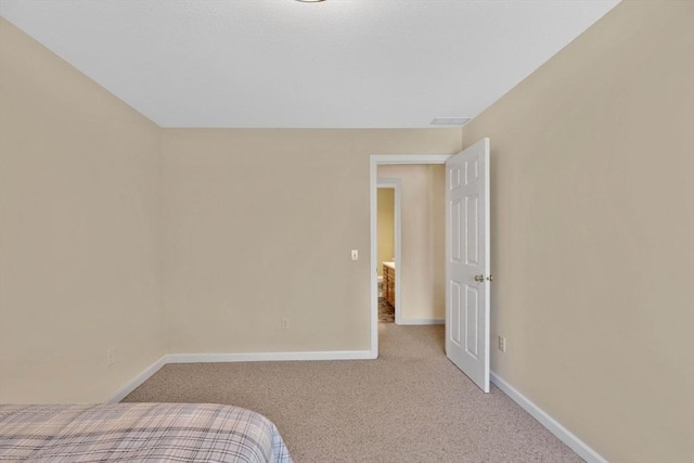24 Heritage Cir E, Longmeadow, MA 01028 - carpeted bedroom with baseboards