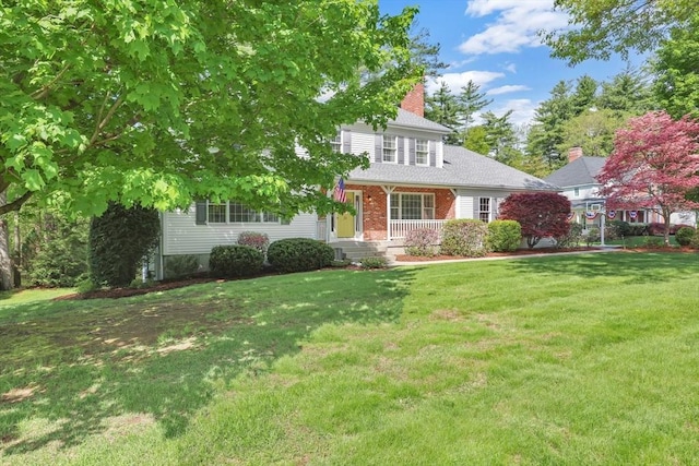 24 Heritage Cir E, Longmeadow, MA 01028 - view of front of home with a chimney, a front yard, and a porch