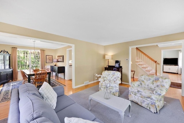 24 Heritage Cir E, Longmeadow, MA 01028 - living room with light wood-style flooring, stairway, and baseboards