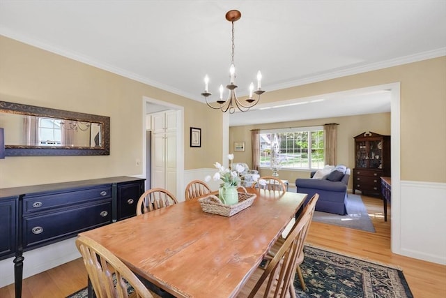 24 Heritage Cir E, Longmeadow, MA 01028 - dining area featuring a chandelier, ornamental molding, wainscoting, and light wood-style floors