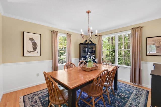 24 Heritage Cir E, Longmeadow, MA 01028 - dining area featuring a chandelier, wainscoting, ornamental molding, and wood finished floors