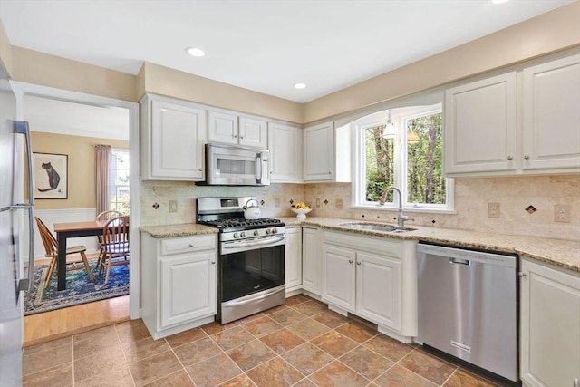 24 Heritage Cir E, Longmeadow, MA 01028 - kitchen featuring appliances with stainless steel finishes, a sink, white cabinets, and recessed lighting