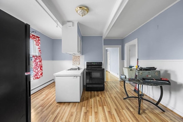 81-83 Walnut St, Lynn, MA 01905 - kitchen with black appliances, baseboard heating, a sink, light wood-type flooring, and crown molding