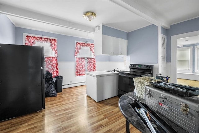 81-83 Walnut St, Lynn, MA 01905 - kitchen with black appliances, baseboard heating, plenty of natural light, ornamental molding, and light wood-type flooring