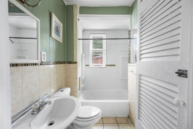 81-83 Walnut St, Lynn, MA 01905 - bathroom with toilet, tile walls, tile patterned floors, a sink, and shower / bath combination
