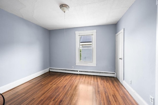 81-83 Walnut St, Lynn, MA 01905 - spare room with dark wood-style floors, a baseboard heating unit, and baseboards
