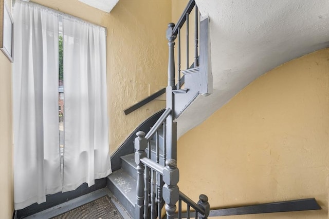 81-83 Walnut St, Lynn, MA 01905 - stairway with a textured wall and lofted ceiling