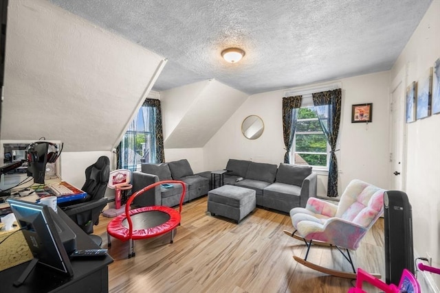 81-83 Walnut St, Lynn, MA 01905 - living room featuring a textured ceiling, wood finished floors, and vaulted ceiling
