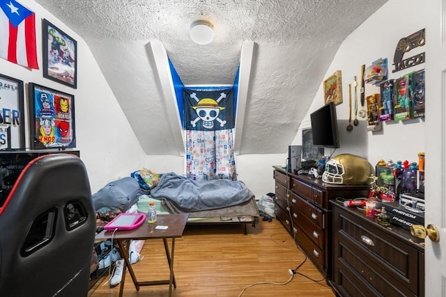 81-83 Walnut St, Lynn, MA 01905 - bedroom with a textured ceiling, light wood-style flooring, and vaulted ceiling