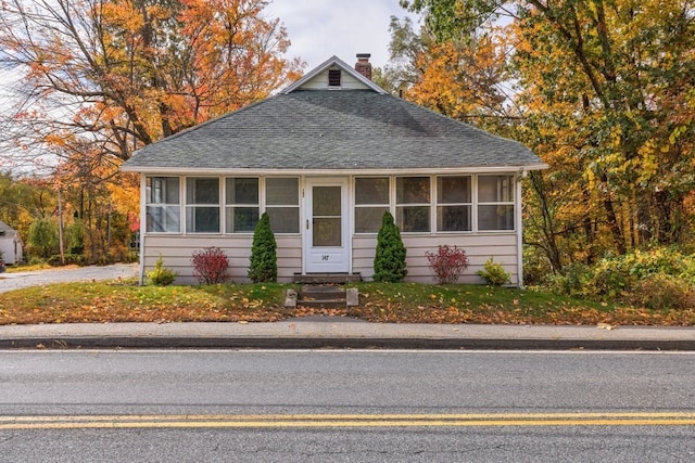 view of front of house with a sunroom