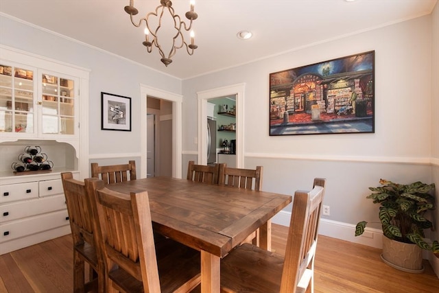 105 Fletcher St Unit 1, Boston, MA 02131 - dining area with light wood-style flooring, a chandelier, ornamental molding, and recessed lighting